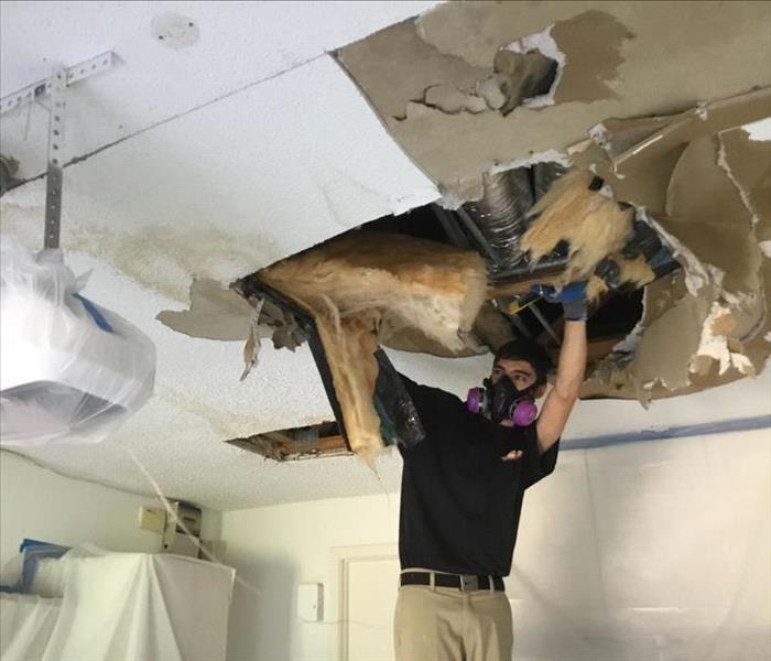 Water damage to the ceiling of a garage